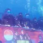 Hari Bhakti Adhyaksa Ke-63 jatuh pada Sabtu 22 Juli 2023 akan diperingati secara tak biasa oleh Kejaksaan Negeri Tolitoli, yakni melangsungkan upacara pengibaran Sang Saka Merah Putih dan Panji Adhyaksa dari bawah laut. (Foto: Puspen Kejaksaan Negeri Tolitoli).