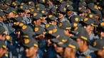 Anggota Satuan Perlindungan Masyarakat (LINMAS) mengambil bagian dalam apel pengamanan pemilu di Banda Aceh pada 8 Februari 2024. (CHAIDEER MAHYUDDIN/AFP)