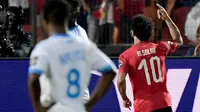 Winger Timnas Mesir, Mohamed Salah, berhasil mencetak satu gol sekaligus membantu timnya menang 2-0 atas Kongo pada laga kedua Grup A Piala Afrika 2019, Rabu (26/6/2019). (AFP/Javier Soriano)