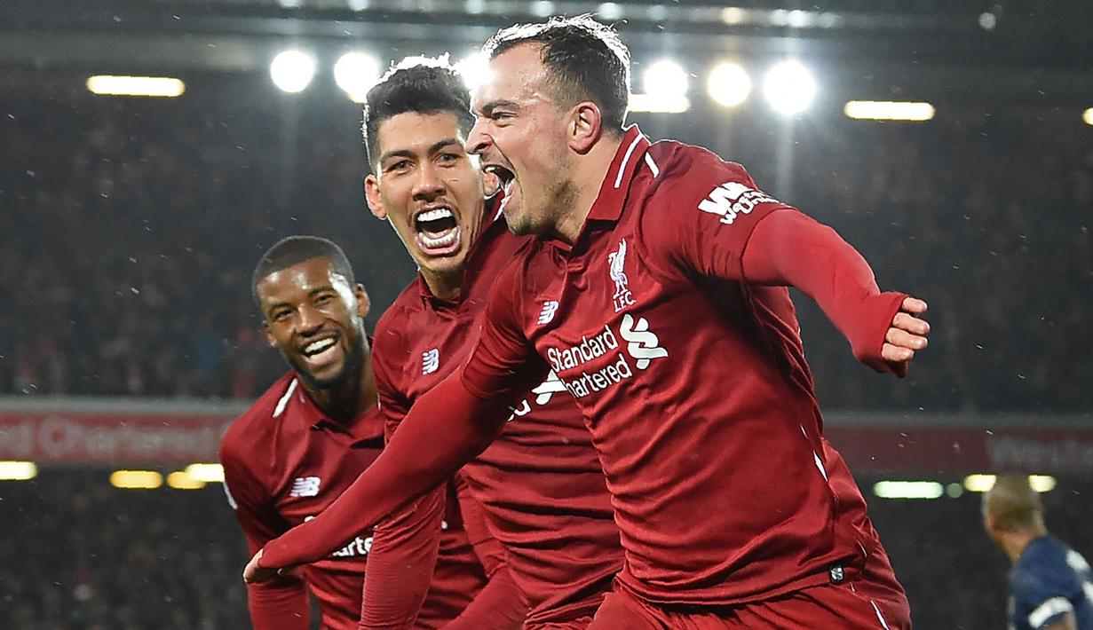 Gelandang Liverpool, Xherdan Shaqiri, merayakan gol yang dicetaknya ke gawang Mnachester United pada laga Premier League di Stadion Anfield, Liverpool, Minggu (16/12). Liverpool menang 3-1 atas MU. (AFP/Paul Ellis)