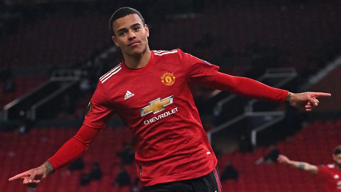 Mason Greenwood menjadi pencetak gol tunggal yang berhasil mengantarkan kemenangan Manchester United kala bertandang ke Wolves. Gol tersebut juga berhasil mencetak sejarah menyamai rekor Robbie Fowler. Ia tercatat sudah mengoleksi tiga gol hingga pekan ketiga Liga Inggris. (Foto: AFP/Paul Ellis)