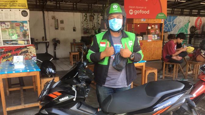 Salah satu driver Gojek, Gerry Irawan mengaku terbantu dengan edukasi serta fitur verifiikasi muka dari Gojek (Liputan6.com/Luthfie Febrianto)