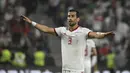 Pemain dengan caps terbanyak di Grup B Piala Dunia 2022 adalah Ehsan Hajsafi. Ia tercatat telah membuat 121 penampilan bersama Timnas Iran. Hajsafi merupakan kapten sekaligus pemain paling berpengalaman di Skuad Iran. Pemain yang berposisi sebagai bek kiri tersebut menghabiskan banyak kariernya di dalam negeri dan telah memenangkan berbagai gelar domestik. Kini, ia bermain untuk klub Yunani, AEK Athens. (AFP/Khaled Desouki)