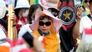 Buruh menggelar karnaval dan deklarasi saat Perayaan Peringatan Hari Buruh Sedunia, Jakarta, Selasa (1/5). Salah satu isi maklumatnya terpenuhinya Lima Jaminan Sosial, yaitu Jaminan Kesehatan, Jaminan Kecelakaan Kerja. (Liputan6.com/Johan Tallo)