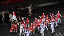 Tim Indonesia tiba pada upacara pembukaan Paralimpiade Tokyo 2020 di Stadion Olimpiade Tokyo pada 24 Agustus 2021. (AFP/Charly Triballeau)
