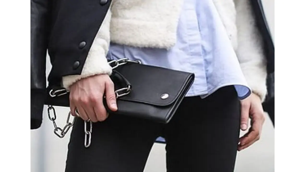 T-shirt Beneath a Fuzzy Sweater and Varsity Jacket