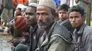 Ekspresi warga Rohingyah yang diamankan sementara di Idi Rayeuk, Aceh Timur (4/12). Sekitar 20 orang yang diyakini warga Rohingya telah diamankan di Pos Pangkalan Angkatan Laut (Lanal) Idi. (AFP Photo/Cek Mad)