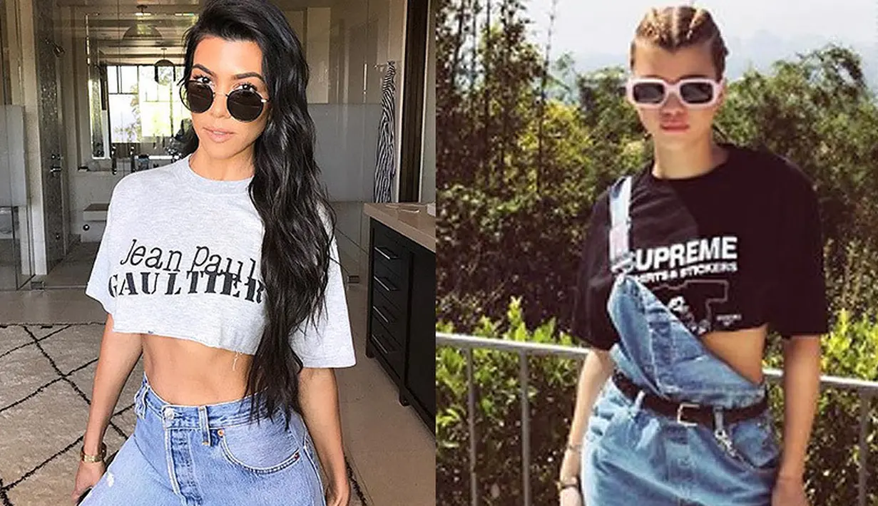 Crop top yang dipadukan dengan jeans. Mana nih yang lebih menarik perhatian? (HollywoodLife)