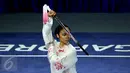 Ekspresi atlet wushu Indonesia, Lindswell Kwok saat tampil di nomor pedang TaijiJian SEA Games 2015 di SingaporeExpo, Singapura, Senin (8/6/2015). Lindswell Kwok berhasil meraih medali emas setelah mengumpulkan 9.73 poin. (Liputan6.com/Helmi Fithriansyah)
