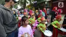 Sejumlah murid TK Islam bermain marching band saat berjalan bersama di Jalan Raya Radjiman Widyo Ningrat, Jakarta, Sabtu (26/3/2022). Pawai menyambut datangnya bulan suci Ramadan 1443 Hijriah ini diikuti puluhan murid TK Islam dari berbagai sekolah. (merdeka.com/Imam Buhori)