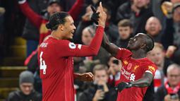 Di Grup A, dua pemain Liverpool, Sadio Mane (Senegal) dan Virgil van Dijk (Belanda) akan saling berhadapan di matchday pertama Grup A sekaligus partai pembuka Piala Dunia 2022 Qatar, 21 November 2022. (AFP/Paul Ellis)