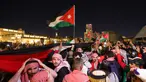 Suporter Yordania merayakan kemenangan tim mereka atas Korea Selatan pada semifinal Piala Asia 2023 di Stadion Ahmad Bin Ali di Al-Rayyan, Doha, pada 6 Februari 2024. (Giuseppe CACACE/AFP)