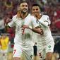 Pemain Maroko, Hakim Ziyech merayakan gol pertama timnya ke gawang Kanda saat matchday ketiga Grup F Piala Dunia 2022 di Al Thumama Stadium, Doha Kamis (01/12/2022). (AP/Pavel Golovkin)