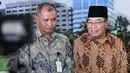 Ketua KPK Agus Raharjo (kiri) dan Ketua BPK Harry Azhar Azis memberi keterangan pers usai pertemuan tertutup di BPK, Jakarta, Rabu (13/1). Pertemuan itu  guna meningkatkan koordinasi antara dua lembaga dalam penanganan korupsi (Liputan6.com/Johan Tallo)