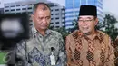 Ketua KPK Agus Raharjo (kiri) dan Ketua BPK Harry Azhar Azis memberi keterangan pers usai pertemuan tertutup di BPK, Jakarta, Rabu (13/1). Pertemuan itu  guna meningkatkan koordinasi antara dua lembaga dalam penanganan korupsi (Liputan6.com/Johan Tallo)