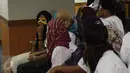 Sejumlah korban dihadirkan saat konferensi pers di Bareskrim Polri, Jakarta, Rabu (17/5). Kepolisian menangkap sembilan tersangka tindak pidana perdagangan orang. (Liputan6.com/Faizal Fanani)