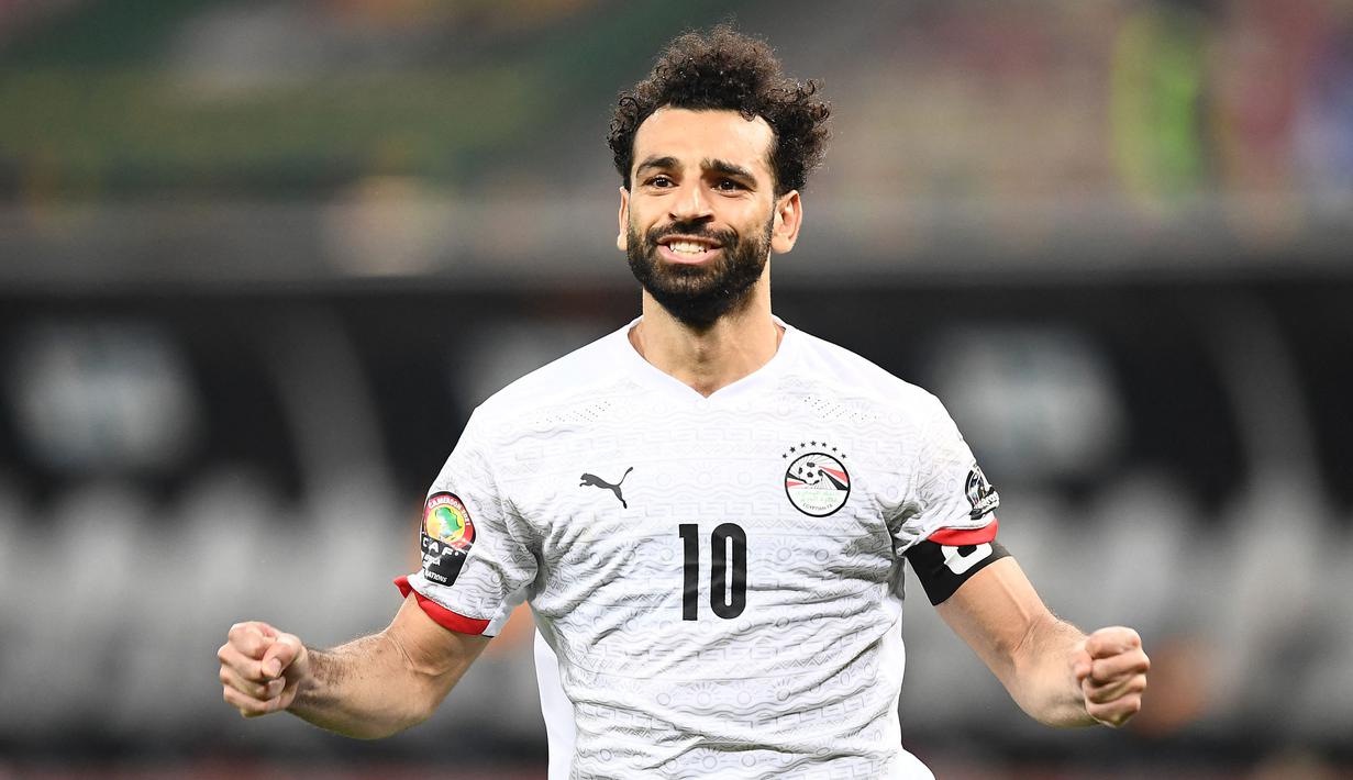 Mohamed Salah berhasil menjadi penentu kemenangan Mesir saat menumbangkan Pantai Gading di babak 16 besar Piala Afrika 2021 yang berlangsung di Stade Omnisport de Douala, Rabu (26/1/2022) malam WIB. (AFP/Charly Triballeau)