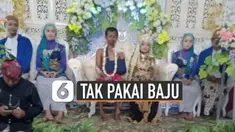 Pengantin pria tidak memakai baju dan badannya penuh perban saat di pelaminan.