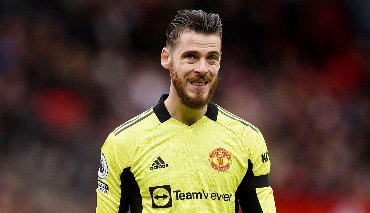 David de Gea - Lolosnya Spanyol ke Piala Dunia 2022 membuat kiper Manchester United ini mempunyai kesempatan bermain di pesta sepak bola terbesar di dunia tersebut. Untuk sekedar informasi, sepanjang kualifikasi De Gea belum sekalipun bermain lantaran kalah bersaing dengan Unai Simon. (AFP/Oli Scaff