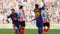 Lionel Messi menyumbangkan satu gol sekaligus membantu Barcelona menang 2-0 atas Athletic Bilbao pada laga pekan ke-29 La Liga Spanyol, di Camp Nou, Minggu (18/3/2018). (AFP/Pau Barrena)