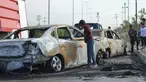 Seorang remaja melihat mobil yang hancur akibat bom di Ameriyat Falluja, Irak, Jumat (18/11). Mobil tersebut sengaja dijadikan bom yang diduga dilakukan oleh kelompok ISIS. (Reuters/Osamah Waheeb) 