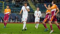 Harry Kane berhasil mencetak empat gol saat Timnas Inggris menang 10-0 atas San Marino pada laga terakhir Grup I kualifikasi Piala Dunia 2022 di San Marino Stadium, Selasa (16/11/2021) dini hari WIB. (AP Photo/Antonio Calanni)