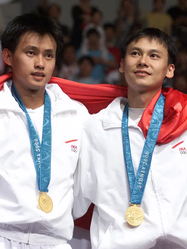 Candra Wijaya (kiri) dan Tony Gunawan, juara ganda putra Olimpiade Sydney 2000. (AFP/Robyn Beck)