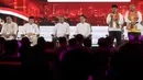 Pasangan calon gubernur dan wakil gubernur DKI Jakarta nomor urut 3, Pramono Anung-Rano Karno saat menyampaikan visi misi dalam segmen pertama pada debat perdana calon gubernur dan wakil gubernur DKI Jakarta di JIExpo, Kemayoran, Jakarta Pusat, Minggu (6/10/2024). (Liputan6.com/Herman Zakharia)