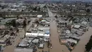 Foto udara menunjukkan sebagian besar Kota Pajaro, California, Monterey County, terendam air banjir tepat di seberang Sungai Pajaro dari Watsonville, California, Amerika Serikat, 12 Maret 2023. Cuaca yang tidak bersahabat masih menyelimuti sebagian besar negara bagian California. (Shmuel Thaler/The Santa Cruz Sentinel via AP)