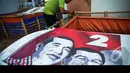 Spanduk Jokowi-JK dijadikan pelindung ternak lele di Rusun Marunda, Jakarta, Selasa (19/8/2014) (Liputan6.com/Faizal Fanani)