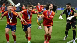 Ini menjadi gelar keempat untuk Spanyol di ajang kompetisi sepakbola benua Eropa. (INA FASSBENDER/AFP)