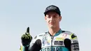 Pembalap Moto3 Lorenzo Dalla Porta berpose di depan Valencia Motorcycle Grand Prix, Spanyol, Minggu (17/11/2019). Lorenzo Dalla Porta sukses merebut gelar juara dunia Moto3 tahun 2019. (AP Photo/Alberto Saiz)
