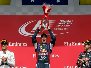 Pembalap Formula Satu, Daniel Ricciardo (tengah) tampil tercepat di GP Kanada yang digelar di Sirkuit Gilles Villeneuve, Montreal (8/6/2014). (REUTERS/Chris Wattie)