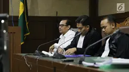 Terdakwa dugaan suap seleksi pengisian jabatan di Kementerian Agama, Haris Hasanuddin (kanan) saat menjalani sidang lanjutan di Pengadilan Tipikor, Jakarta, Rabu (10/7/2019). Sidang mendengar keterangan saksi. (Liputan6.com/Helmi Fithriansyah)