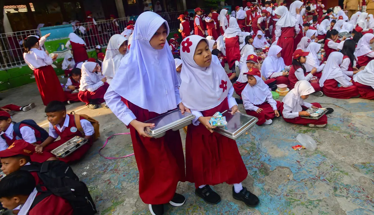 Siswa usai menyantap makanan Program Makan Bergizi Gratis (MBG) di SDN Meruyung, Depok, jawa Barat, Senin, 13 Juli 2007. (KLY/ Arie Basuki)