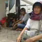 Inang Sitorus, penjual uang pecahan baru di Terminal Rawamangun, Jakarta (Liputan6.com/Audrey Santoso)