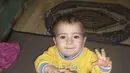 Foto Aylan Kurdi yang diletakkan di rumah bibinya, Tima Kurdi di Coquitlam, British Columbia, Kamis (3/9/2015). Bocah tiga tahun itu terdampar di pantai Turki dalam kondisi tak bernyawa. (REUTERS/Kurdi family)