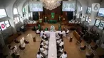 Suasana Ibadah Perjamuan Kudus tatap muka pertama di Gereja Protestan Indonesia Bagian Barat (GPIB) Effatha, Jakarta, Minggu (3/10/2021). Ibadah tatap muka ini berlangsung setelah DKI Jakarta menurunkan status PPKM dari Level 4 menjadi level 3. (Liputan6.com/Johan Tallo)