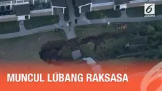 Sebuah lubang raksasa muncul di antara dua bangunan kondominium di California. Diduga terjadi karena runtuhnya saluran air di bawah tanah.