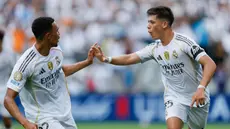 Pemain Real Madrid, Arda Guler dan Trent Alexander-Arnold melakukan selebrasi setelah mencetak gol ke gawang Pachuca pada laga matchday 2 Grup H Piala Dunia Antarklub 2025 di Bank of America Stadium, Senin (23/06/2025) dini hari WIB. (AP Photo/Nell Redmond)