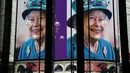 <p>Gambar Ratu Elizabeth II dari Inggris ditampilkan pada layar digital besar untuk menandai dimulainya Platinum Jubilee di Piccadilly Circus, 6 Februari 2022. Ratu Elizabeth II menjadi raja Inggris pertama yang memerintah selama tujuh dekade. (Daniel LEAL/AFP)</p>