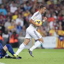 Striker Real Madrid, Jese Rodriguez, melakukan selebrasi usai mencetak gol ke gawang Barcelona pada laga La Liga di Stadion Camp Nou, Minggu (20/3/2016). Jese resmi meninggalkan PSG dan bergabung ke Stoke City. (AFP/Josep Lago)