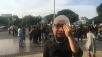 Koalisi Masyarakat Sipil Peduli KPK menggelar aksi di depan Istana Merdeka mendesak Presiden Jokowi membentuk TGPF kasus teror Novel Baswedan, Rabu (11/3/2018). (Liputan6.com/Fachrur Rozie)