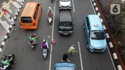 Penerapan sistem ini untuk mendukung pelaksanaan Hari Bebas Kendaraan Bermotor atau Car Free Day (CFD) di kota Depok, Jawa Barat. (Liputan6.com/Herman Zakharia)
