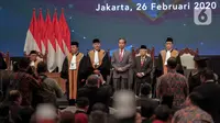 Presiden Joko Widodo bersama Wakil Presiden Ma'ruf saat menghadiri Sidang Pleno Laporan Tahunan Mahkamah Agung Tahun 2019 di JCC, Senayan, Jakarta, Rabu (26/2/2020).  (Liputan6.com/Faizal Fanani)