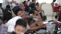 Sejumlah siswa saat hari pertama masuk sekolah di SLB Yayasan Pembinaan Anak Cacat (YPAC) , Jakarta, Senin (8/7/2024). (Liputan6.com/Herman Zakharia)