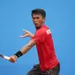 Aditya Sasongko menyumbang poin pertama untuk Indonesia dalam final tenis beregu melawan Thailand di SEA Games 2015 Singapura (Liputan6.com/Helmi Fithriansyah)