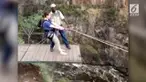 Seorang wanita menguji nyali dengan melakukan bungee jumping di air terjun paling spektakuler di dunia.