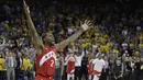 Ekspresi Kawhi Leonard pebasket andalan Toronto Raptors merayakan titel juara NBA pertama bagi klub Raptors. Di gim keenam ia berhasil mencetak 22 poin. (AP Photo/Ben Margot)