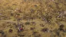 Pemandangan dari udara warga menggali tanah saat mencari batu yang diyakini berlian setelah penemuan batu misteriuas di Desa KwaHlathi, luar Ladysmith, Provinsi KwaZulu-Natal, Afrika Selatan (15/6/2021). (AFP/Phill Magakoe)